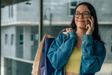 Fototapeta premium young girl with shopping bags