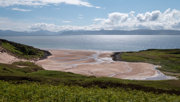 View of a remote sandy bay amid the rugged landscape on the Applecross Peninsula, Scotland UK