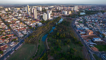 Fototapeta na wymiar Indaiatuba Ecological Park. Beautiful park in the city center, with trees and houses. Aerial view