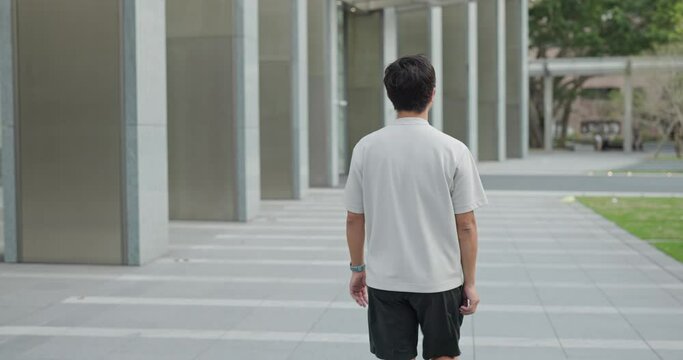 Asian man walk in the street