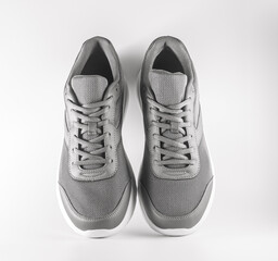 grey sneakers on a white background