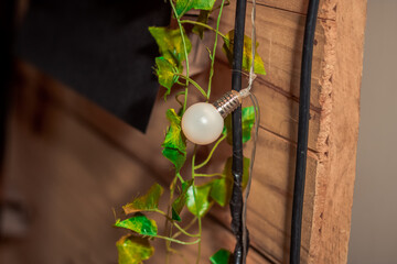 unlit white lamp in decoration with wooden panel