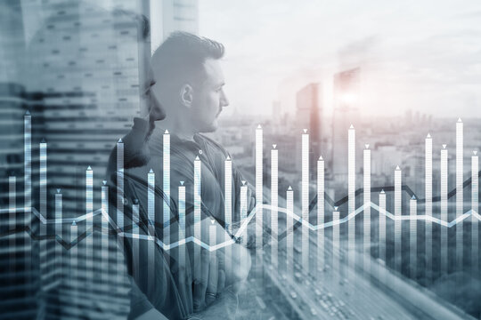 Bar graph on the background of a business center with a manager at the window