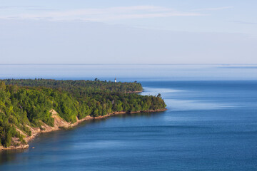 South shoreline of the Lake Superior at the Pictured Lakes National Shoreline with Au Sauble light station in distance, Michigan, United States