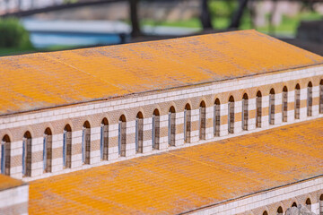 The rhythmic pattern created by the alternation of light and shadow on the windows and arches of...