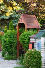 A wooden gate in the shape of an old cottage