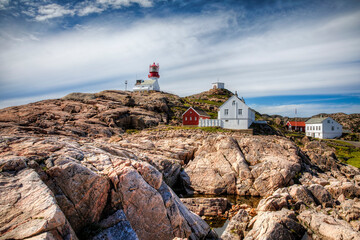 Fototapeta na wymiar Lighthouse at Lindesnes, the Southernmost Point of the Norwegian Mainland