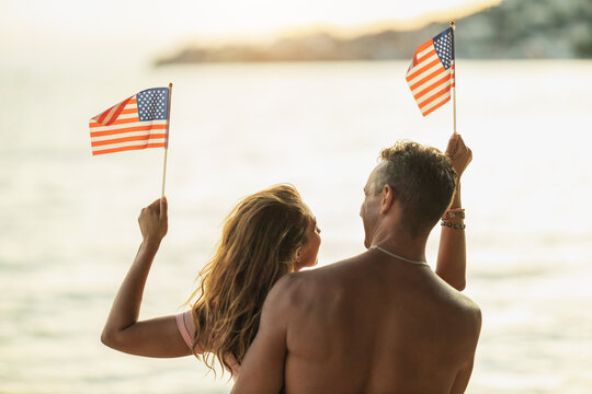 Couple With US National Flag - Powered by Adobe