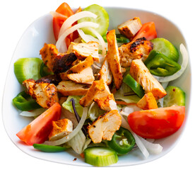 Portion of fresh chicken salad served in bowl. Isolated over white background