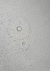 Raindrops on the top window (glass).
Water drops on background.