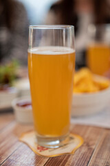 a glass of alcoholic drink beer in a restaurant