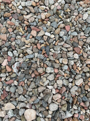 Small stone texture for background. High quality photo.
Rocks on a walk by the water.