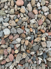 Small stone texture for background. High quality photo.
Rocks on a walk by the water.