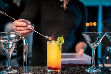 bartender preparing passion fruit mojito drink
