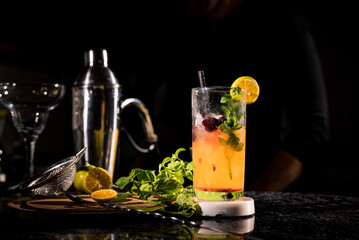 bartender preparing passion fruit mojito drink
