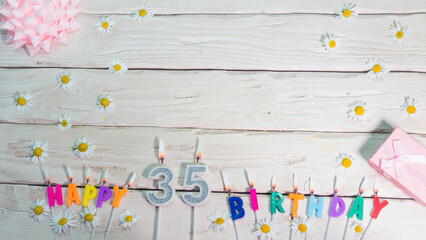 A beautiful card for a birthday in pastel colors in pink shades with a number   35. The decorations...