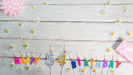 A beautiful card for a birthday in pastel colors in pink shades with a number   54. The decorations...