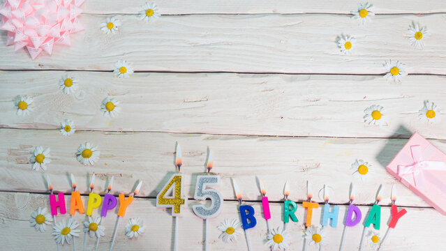 A Beautiful Card For A Birthday In Pastel Colors In Pink Shades With A Number   45. The Decorations Of Their Candles Are Festive From Above, For A Couple Or A Woman With A Happy Birthday Copy Space.