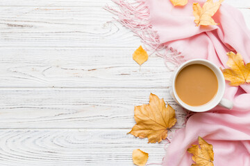 Cup of cocoa with autumn leaves abstract still life top view vith copy space