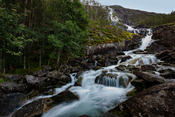 Fototapeta na wymiar Landfoss Waterfall 2000 ft tall cascade flowing into Akrafjorden