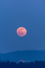 landscape of pink moon in the moonrise
