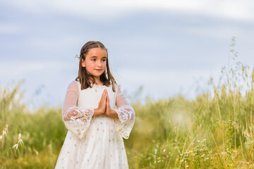 communion girl. catholic religion child celebration hispanic female portrait. summer and spring