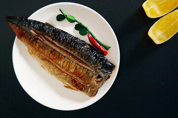Grilled fish dish mackerel on the table