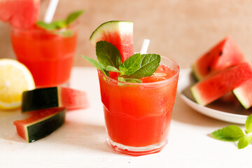 Fresh watermelon juice with ice in a glass.