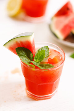 Fresh watermelon juice with ice in a glass.