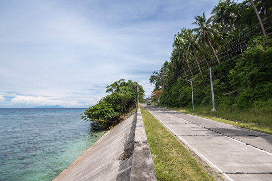 Traveling through a scenic coastal highway bordering the towns of Jagna and Duero in the island of Bohol.
