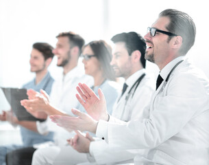 Fototapeta na wymiar Medical team applauding in meeting