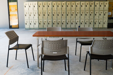 Wooden table and chair in office or University.