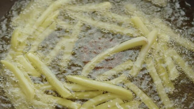 cooking frozen french fries in oil