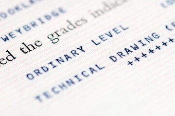 Close up of a United Kingdom education certificate with the holder achieving a grade at the Ordinary Level on a subject of study.