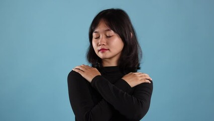 Self love concept. Butterfly hug. A psychology technique for self-soothing from anxiety and anger. A woman cross her arms and tap shoulder.