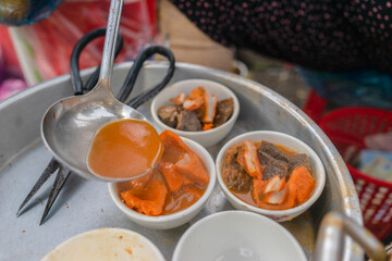 Vietnamese braised beef offal or beef offal stew ( pha lau ): It's a popular snack in southern Vietnam, Vietnamese street food. Food and travel concept.