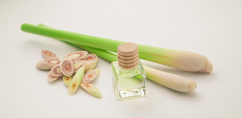 Lemongrass with slice and lemon grass oil bottle isolated on white background.