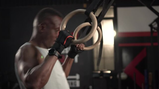 Person in the gym, Sportsman warm up with cable crossover gym machine workout 