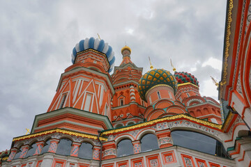 Fototapeta na wymiar Domes of St. Basil's Cathedral against blue sky on a cloudy day morning, at Kremlin sqaure, Moscow