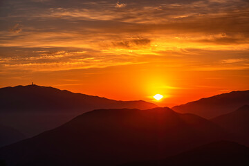 Scenic view of mountains against sky during sunrise