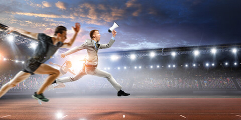 Fototapeta na wymiar Portrait of energetic businessman jumping in open air