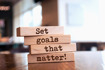 Wooden blocks with words 'Set goals that matter'.