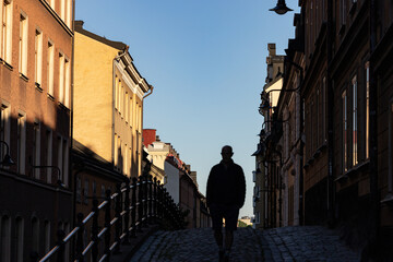Stockholm, Sweden A man walks on the classic Brannkyrkagatan street on Sodermalm in the early morning.