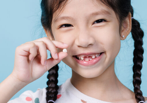7 Years old child has loose tooth, Dentistry and Health care concept