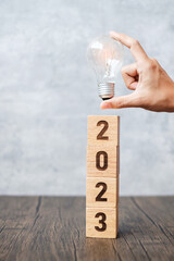 2023 block with lightbulb. Business Idea, Creative, Thinking, brainstorm, Goal, Resolution,...