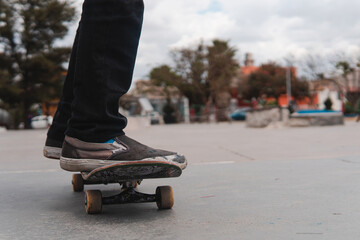 Boy skating calmly in the park