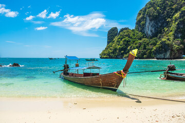 Naklejka na ściany i meble longtail boat on Hong island, Krabi, Thailand. landmark, destination Southeast Asia Travel, vacation and holiday concept