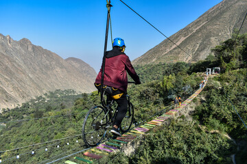 Obraz premium Aerial extreme sport, EXTREME FLYING BIKE, tourist attraction in San Mateo de Otao - Peru.