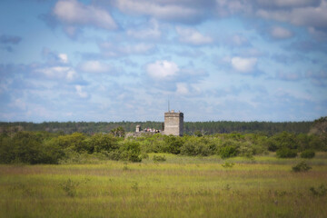 Fototapeta na wymiar Fort Matanza, St. Augustine Florida in the distance of a swampland