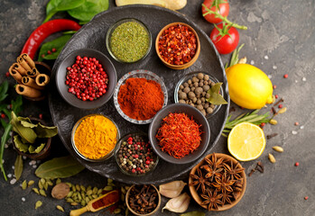 Herbs and spices in metal bowls. Food and cuisine ingredients. Colorful natural additives.